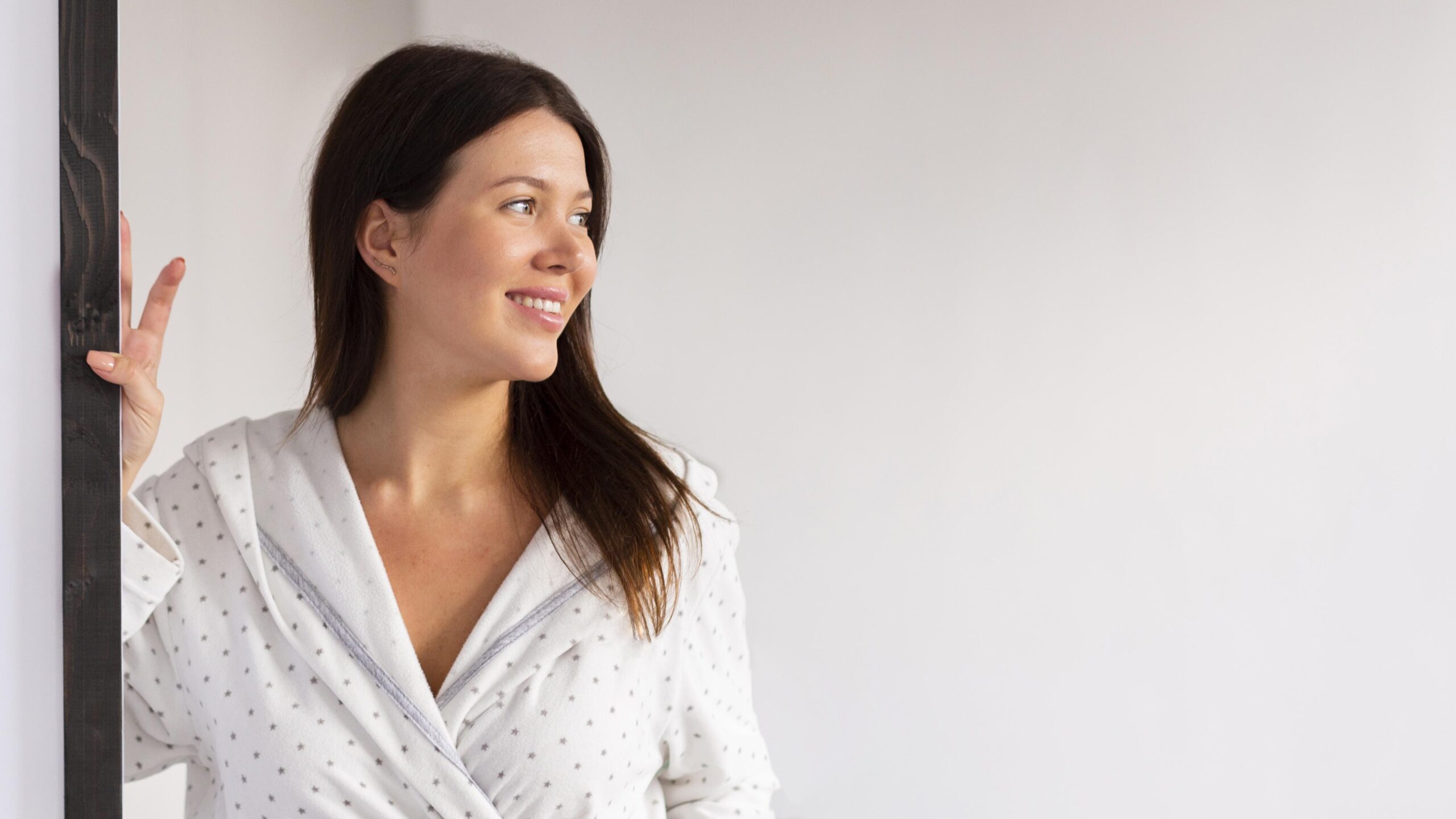 smiley-woman-bathrobe-enjoying-some-self-care